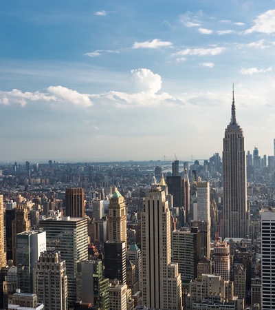 A panoramic view of New York City featuring the iconic Empire State Building.