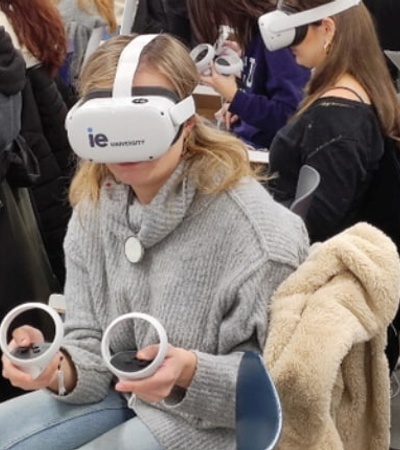 A group of students wearing virtual reality headsets in a classroom setting.