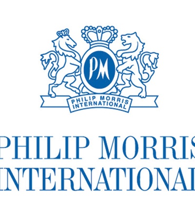 Logo of Philip Morris International featuring a blue emblem with lions and the text 'Philip Morris International'.