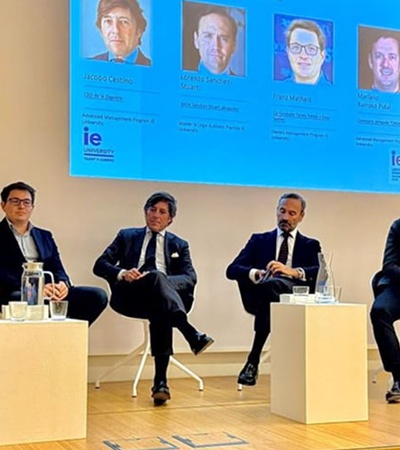 A panel discussion featuring several speakers at an event.