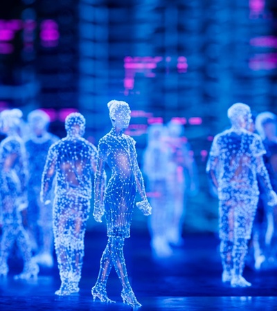 Digital representation of human figures walking in a vibrant virtual cityscape.