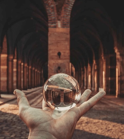 Hand holding a crystal ball
