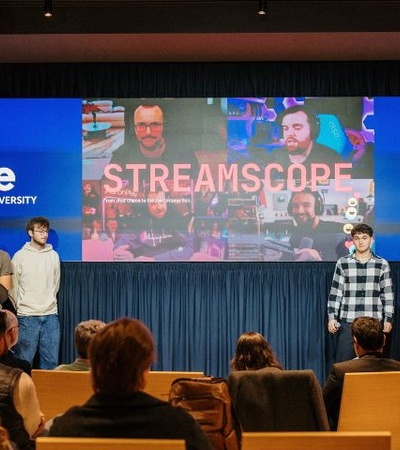 A group of students presenting a project at a university event.
