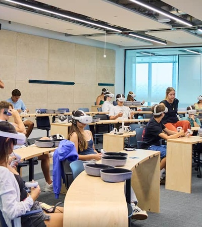 A classroom setting with students engaged in a virtual reality learning experience.