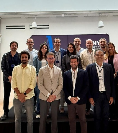 A diverse group of professionals gathered for a photograph at an event.