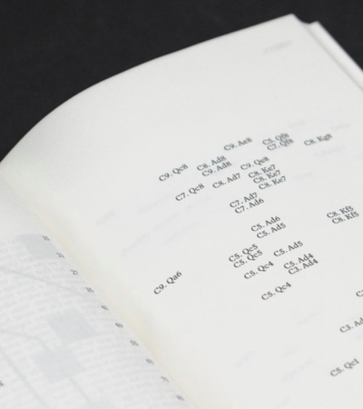 An open book showing pages with text and numbers.