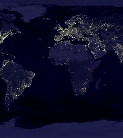 A satellite image showing the night lights of Earth's continents from space.