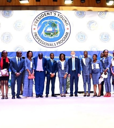 A group of people posing for a photo at an event for the President's Young Professionals Program.