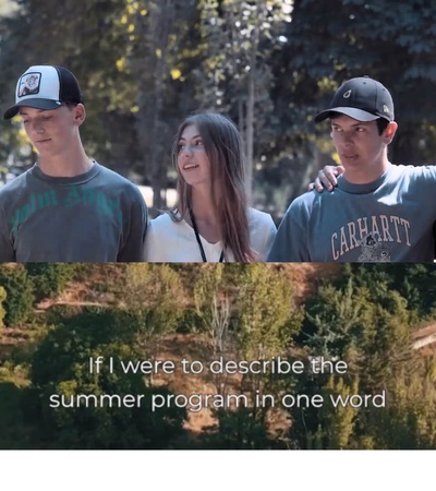 A group of five young people standing outdoors with trees in the background.