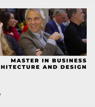A candid moment during a presentation at a business program related to architecture and design.