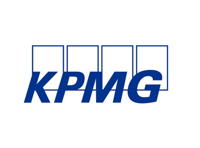 The logo of KPMG in blue letters with a simple design.