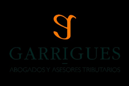 The image displays the logo of Garrigues, which is styled with an orange letter 'G' and the name 'Garrigues' below it, followed by the text 'Abogados y Asesores Tributarios' in Spanish.