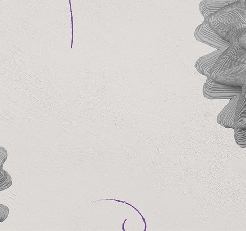This image features abstract shapes with a textured appearance against a light background.