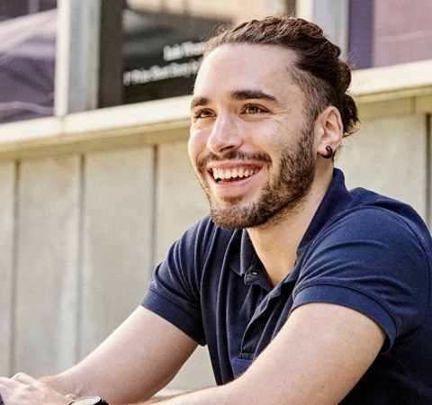 Student from Master in Creative direction, content, branding header (MDCB) with a computer