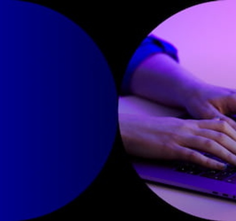 A person using a laptop under blue lighting with the text 'SCI Tech News' and 'IE University School of Science & Technology'.