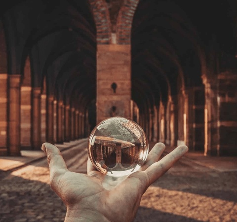 Hand holding a crystal ball