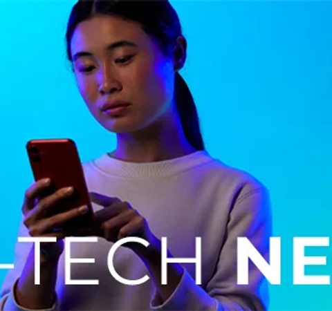 A woman looks at her smartphone with a blue background, overlaid with the text 'SCI-TECH NEWS'.