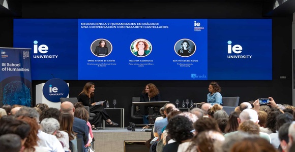A panel discussion featuring three speakers at IE University focused on neuroscience and humanities.