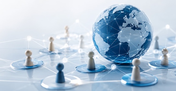 A globe surrounded by networked figures representing global connectivity.