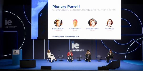A panel discussion at the ICONS Annual Conference 2024 on sustainability, climate change, and human rights, featuring four speakers seated on stage with their names and topics displayed above.