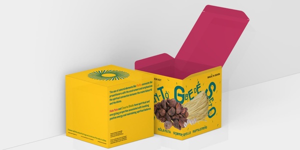 An open yellow box with a pink lid featuring branding and graphics for a natural product.