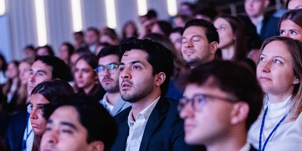 A diverse audience captivated by a presentation or performance.