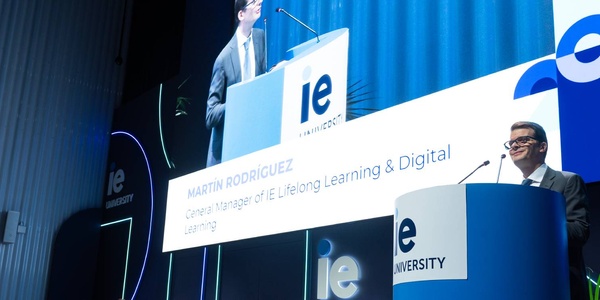A speaker giving a presentation at an event.