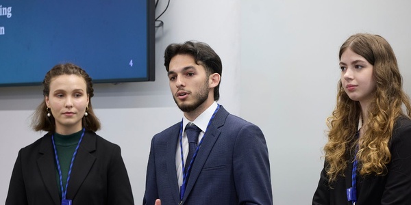 A group of young professionals giving a presentation.