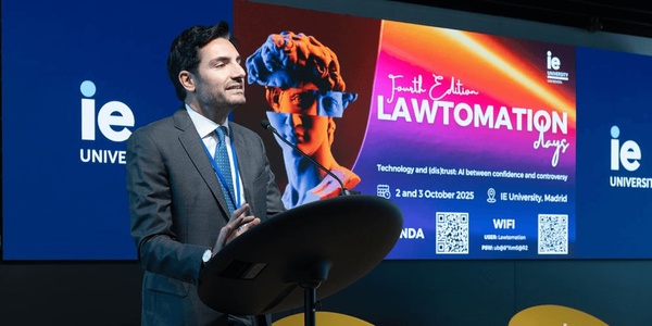 A speaker presenting at an event focused on technology and law.