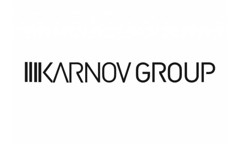 Black and white logo of the Karnov Group with stylized text.