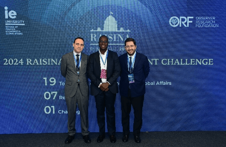 Dean Manuel Muñiz and Vice Dean Angel Alonso, along with IE University's participant Emmanuel Capochichi